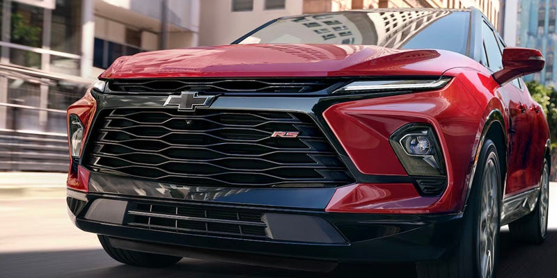 Front view of a Chevrolet Blazer, highlighting its bold grille, sharp headlights, and sleek, sporty design.