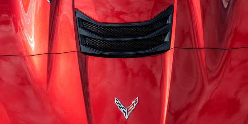 Red Corvette Z06 on race track