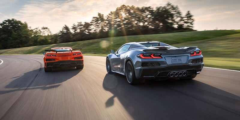 Blue and Red Corvette Z06 on race track