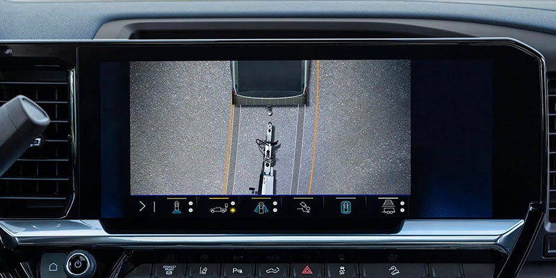Touchscreen display showing hitch camera view for trailer