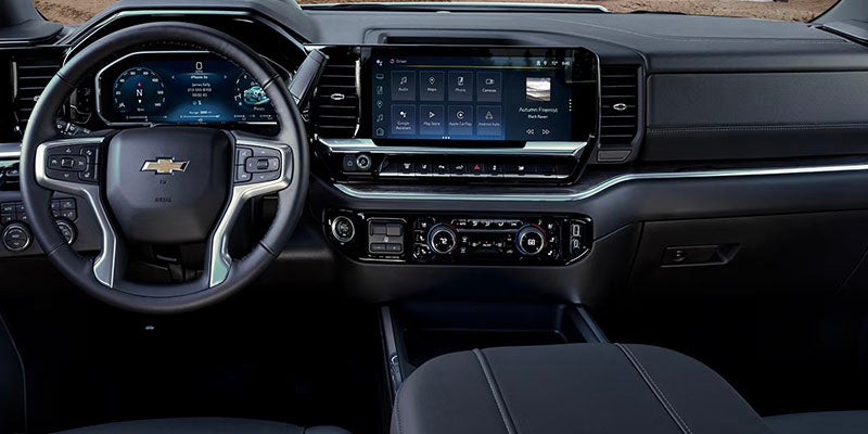 Dashboard and steering wheel inside Chevrolet Silverado truck
